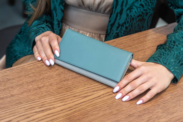 istock The girl has a wallet on the wood table 1280206222
