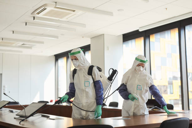 two people disinfecting office - bio hazard imagens e fotografias de stock