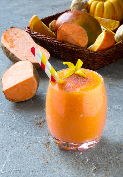 Sweet Potato Smoothie coctail with orange, Cinnamon and ginger. Vitamin, healthy food concept. Copy space stock photo