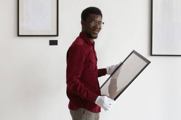 istock African-American Man Planning Art Gallery Set Up 1280209537