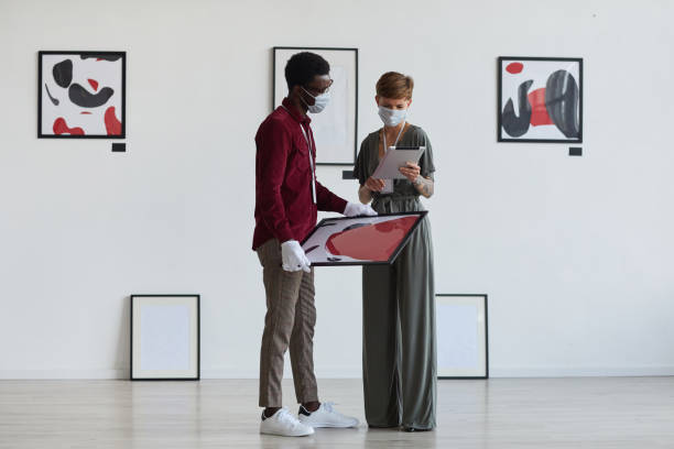 People Wearing Masks Planning Modern Art Gallery