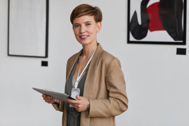 Smiling Young Woman Managing Art Gallery