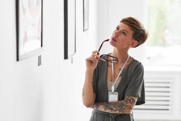 istock Elegant Woman Managing Art Gallery 1280209615