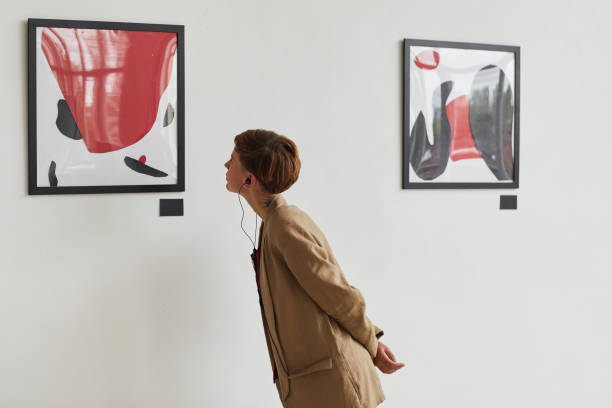 istock Young Woman Looking at Modern Art 1280209660