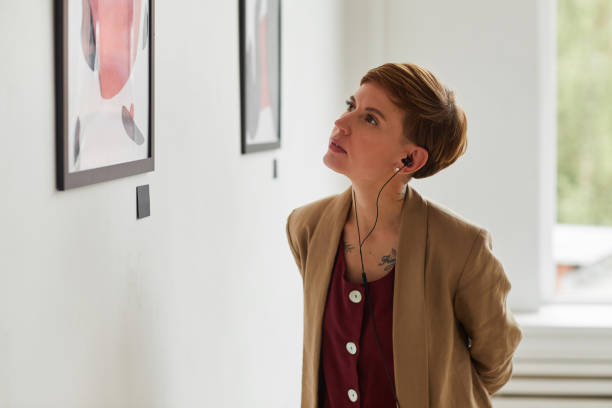 istock Young Woman Looking at Paintings in Museum 1280209669