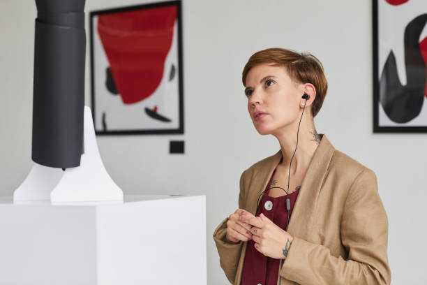 istock Young Woman Looking at Modern Art in Museum 1280209681