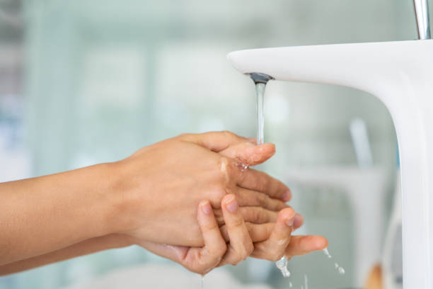 istock Woman washing her hands 1280209696