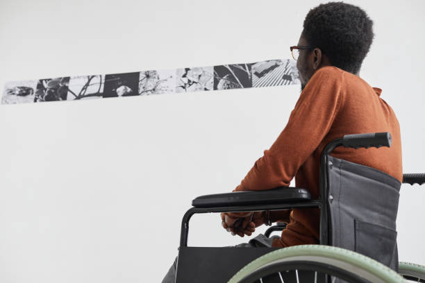 istock Man in Wheelchair Visiting Art Museum 1280209729