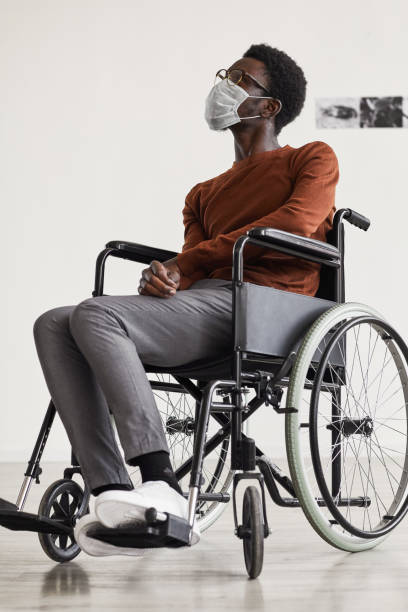 istock Handicapped Young Man Wearing Mask in Museum 1280209750