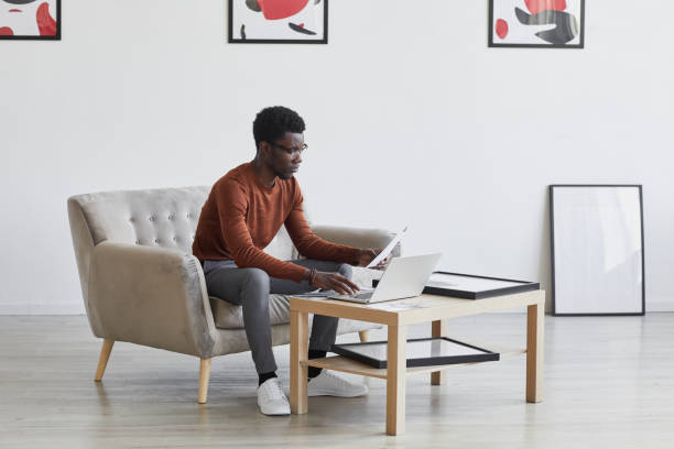 istock Young African Businessman Working in Designer Interior 1280209776