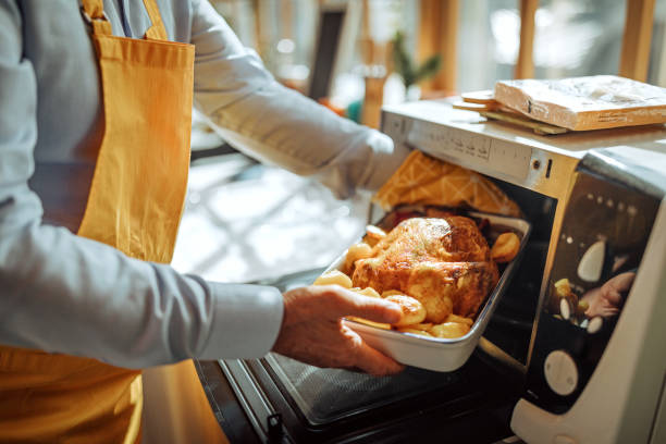 istock Man preparing roasted turkey for lunch 1280209838