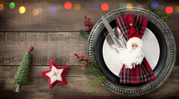 istock Holiday Christmas Dining Plate on an Old Wood Table 1280209970