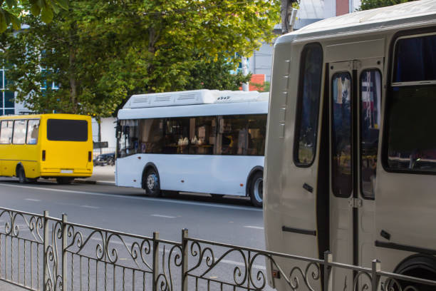 istock Shuttle buses move along the city street 1280210497