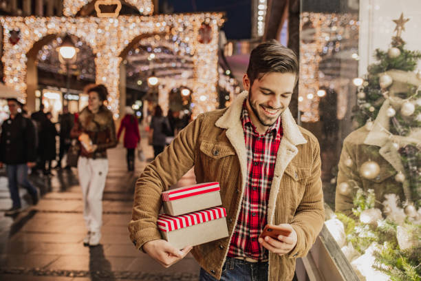 istock Young man in Christmas shopping 1280211026