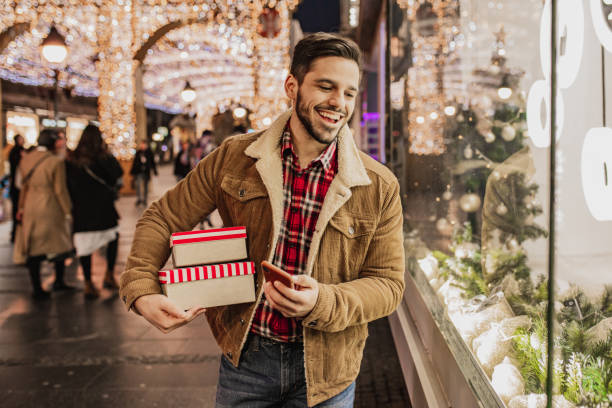 Young man in Christmas shopping