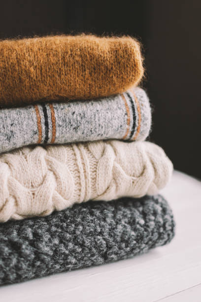 istock Cozy hand knitted knitwear on a dark background. 1280211807