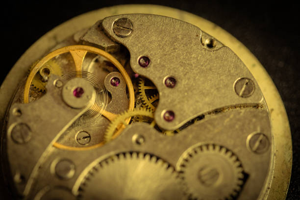 istock Old clockwork mechanism in close-up. Selective focus on macro details. Light vintage toning. Grunge style backdrop 1280212034