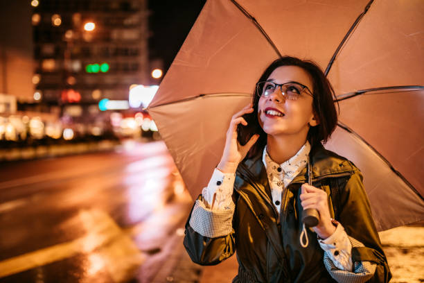 istock Woman talking on phone downtown 1280213015