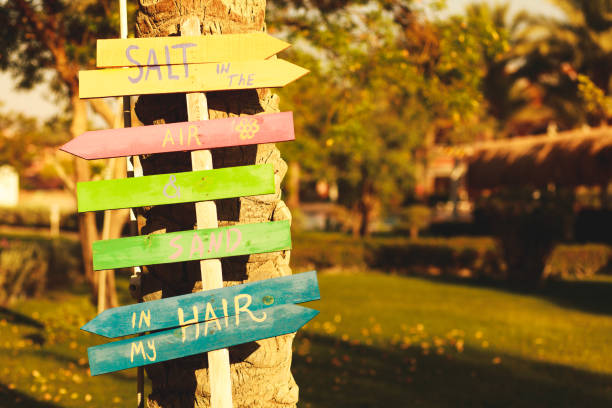 wooden sign to encourage guest to enjoy the beach - tourism outdoors egypt africa imagens e fotografias de stock