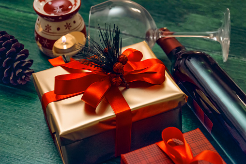Christmas gifts on a green wood table - close up
