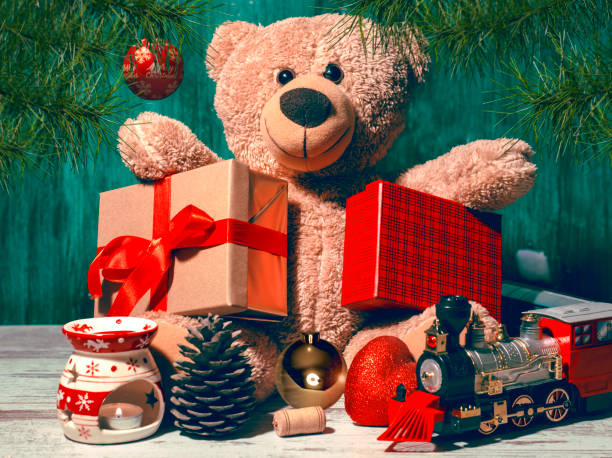istock A teddy bear holding christmas gifts 1280213866