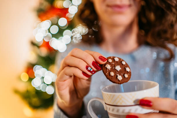 istock Eating Christmas cookies with hot chocolate 1280214512