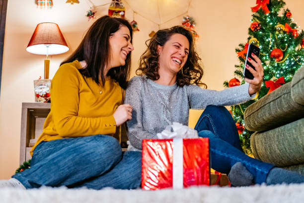 istock Female friends making Christmas selfie 1280214704
