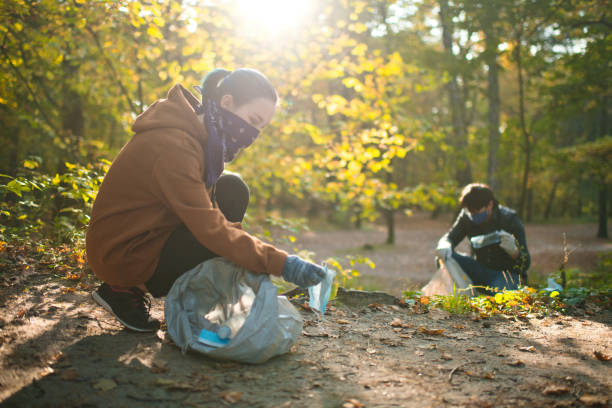istock Volunteers cleaning nature from masks and plastic 1280217318