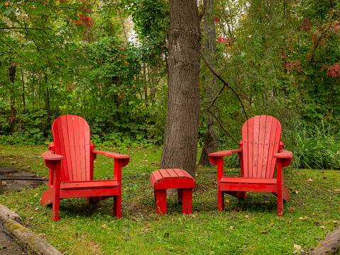 Couple of adirondack chairs in a quiet peaceful location