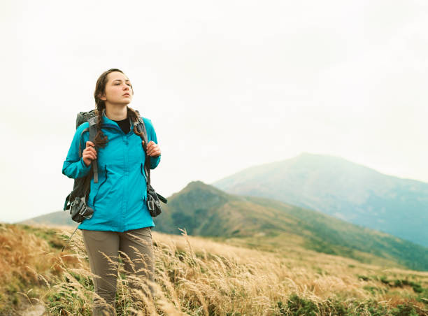 istock Woman hiking in mountains 1280218385