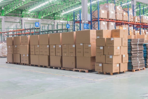 istock interior of warehouse. Rows of shelves with boxes 1280218429