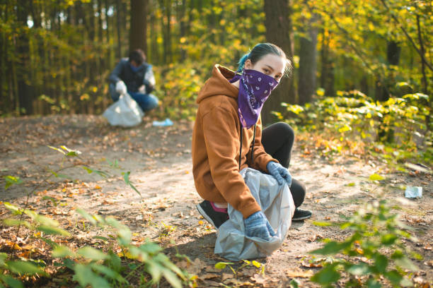 istock Volunteers cleaning nature from masks and plastic 1280219260