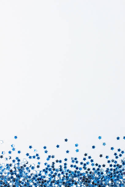 istock Blue confetti on white. Colorful Christmas or holiday background 1280219646