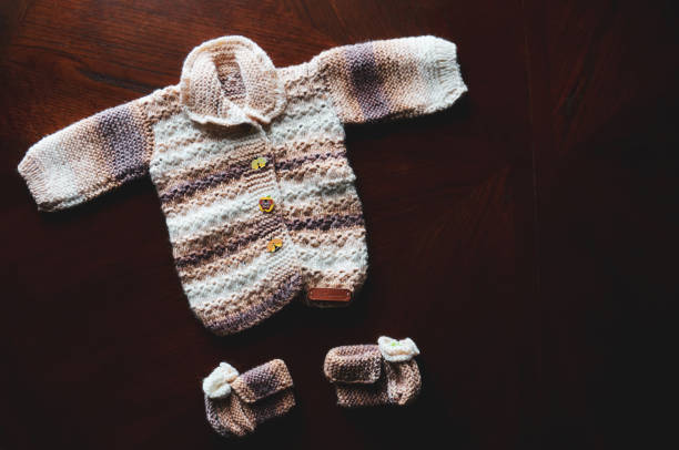 istock Baby clothes flat lay closeup. handmade 1280220733