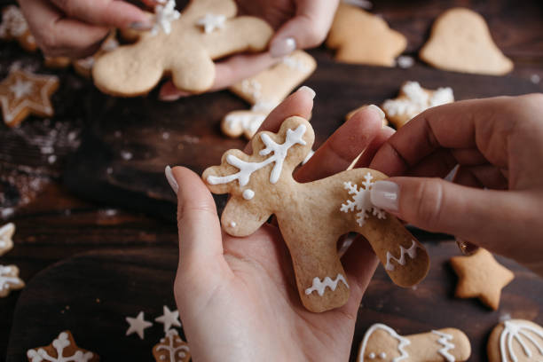 istock Family decorating Christmas gingerbread cookies 1280221909