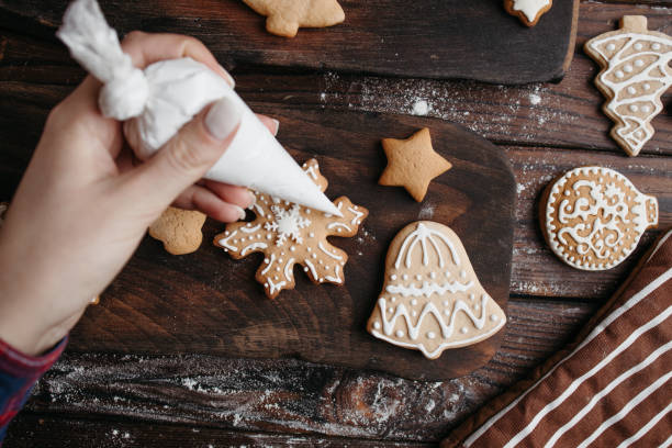 istock Decorating Christmas gingerbread cookies 1280221911