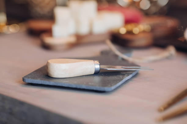 istock Close up of cheese fork on the festive table 1280222571
