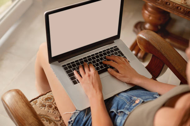 istock Woman working on a laptop. Female using a laptop for searching web, browsing information, having workplace at home. Workspace with laptop. Distance learning 1280222886