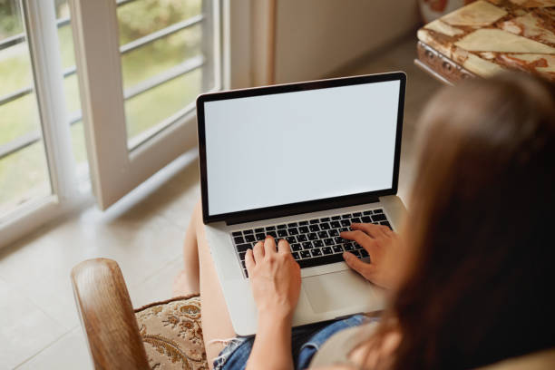 istock Woman working on a laptop. Female using a laptop for searching web, browsing information, having workplace at home. Workspace with laptop. Distance learning 1280222890