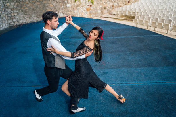 istock Man and woman dancing Latino dance 1280223852