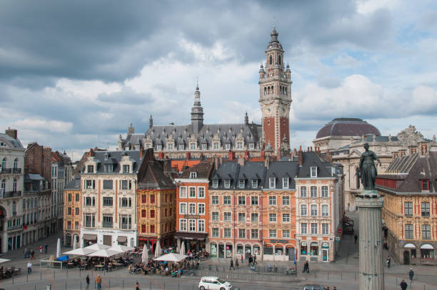 Lille, France town center Lille, France, May, 2012. Place du General de Gaulle (Grand Place). Historic city center with clock tower, buildings, Goddess statue. Lille, France. 2012. Editorial use only. bell tower tower stock pictures, royalty-free photos & images