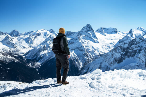 istock Traveller solitude in the snowy mountains 1280226553