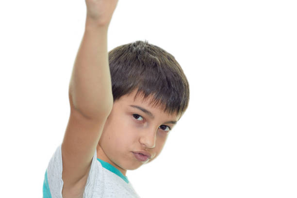 istock a dark haired confident boy shoots a finger at the camera 1280226746