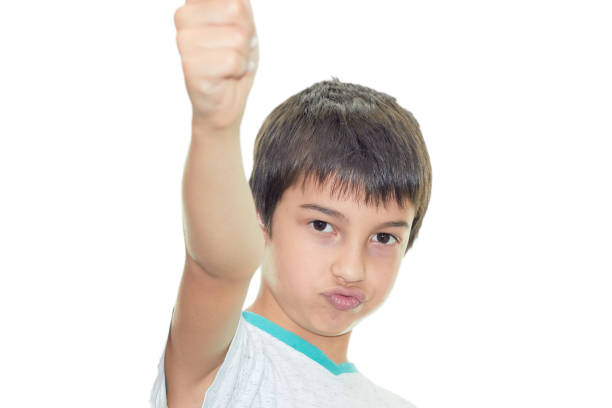 istock a dark haired confident boy shoots a finger at the camera 1280227514