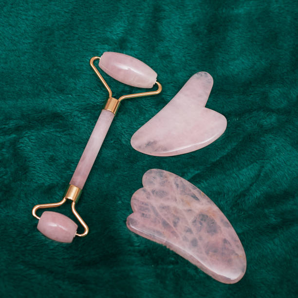 istock Facial massage kit. Face roller and gua sha massager made from natural stones. 1280228366