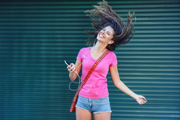 istock Woman dancing to the music 1280228395