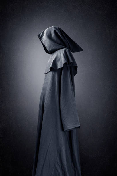 istock Scary figure in hooded cloak 1280228437
