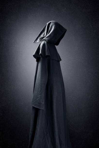 istock Scary figure in hooded cloak 1280228441