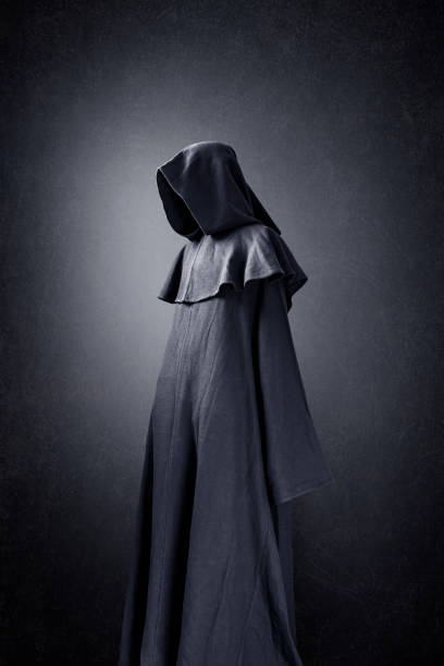 istock Scary figure in hooded cloak 1280228442