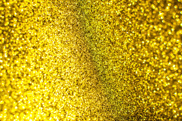 istock Flickering bright gold background. Bright gold or yellow texture. 1280231931